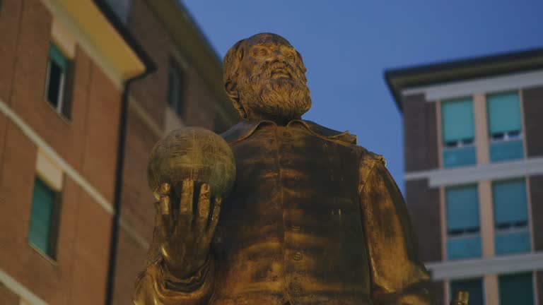 Galileo Galilei Italian scientist bronze sculpture after twilight, Pisa, Tuscany