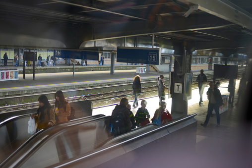 Gare du Nord, Brussels, Belgium - February 17, 2024: higher view from inside a double deck passenger train travelers getting off the escalator on the station platform Gare du Midi Brussels