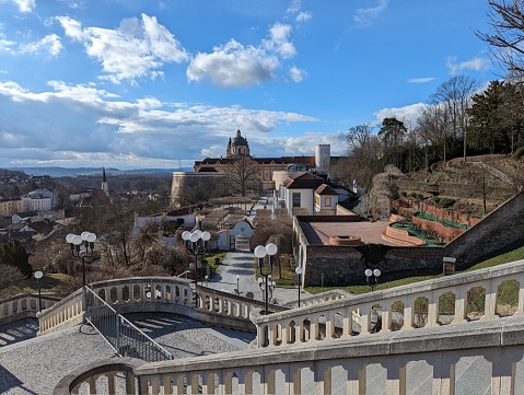 An empty stairway with Melk Abbey in the background. Austria