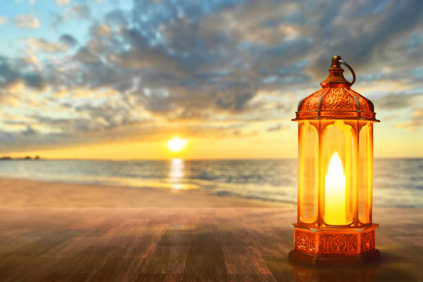 istock Arabic lantern on sea beach at beautiful sunset sky with cloud, Ramadan kareem background 2022181060