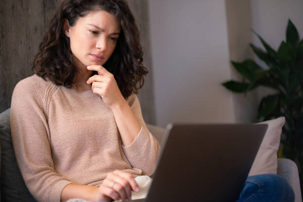 istock Serious woman looking at laptop 2022191407