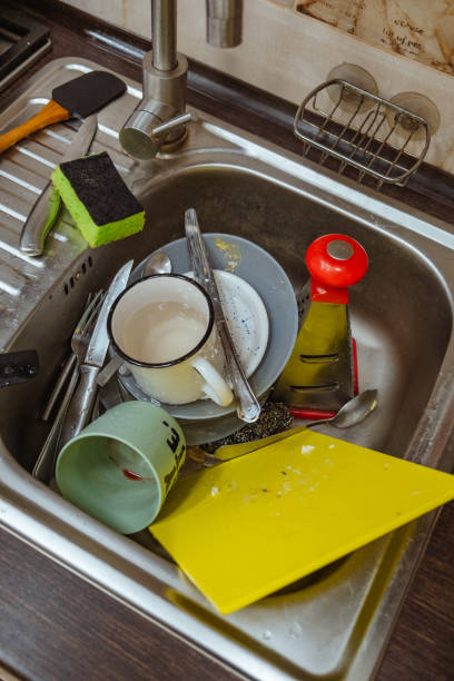 istock dirty dishes in sink 2022198368