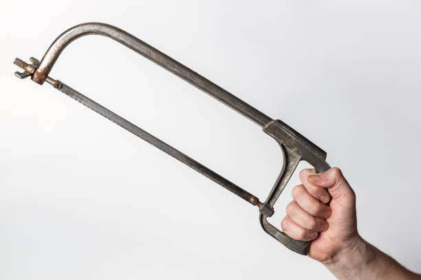 A hand hacksaw of old manufacture, on a white background stock photo