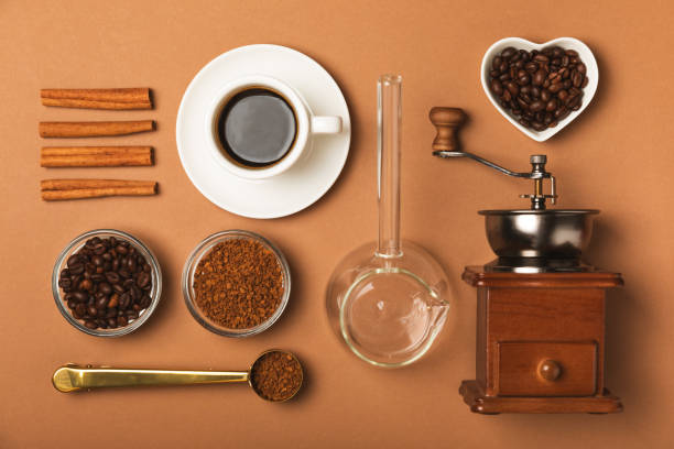 istock Ingredients for making coffee. Moka pot, Turkish coffee pots (cezve), coffee grinder with coffee beans, milk, sugar and spices on a white background. Drink preparation concept. Flat Lay.Copy space. 2022226423