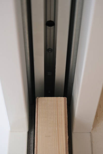istock Pocket door in a white plasterboard wall (sliding door inside a wall) 2022241506