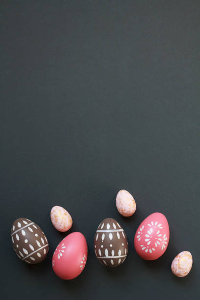 istock Happy Easter concept with elegant Easter eggs decorated with spring ornaments on dark gray background with copy space 2022243609