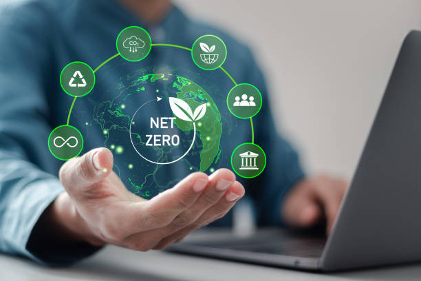 istock Net zero and carbon neutral concept. Businessman using laptop and holding net zero greenhouse gas emissions icon on virtual screen for climate neutral long term strategy. 2022245826