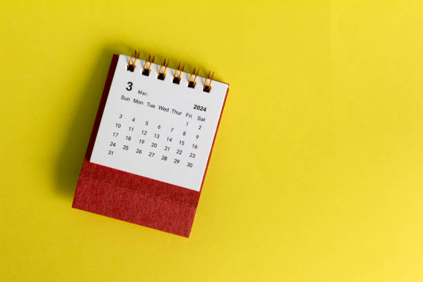 istock Desk calendar for March 2024 on a yellow background, with copy space. 2022251077
