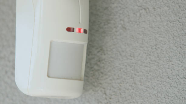 istock Motion sensor on the wall of the house. LED indicators light up to detect movement 2022251085