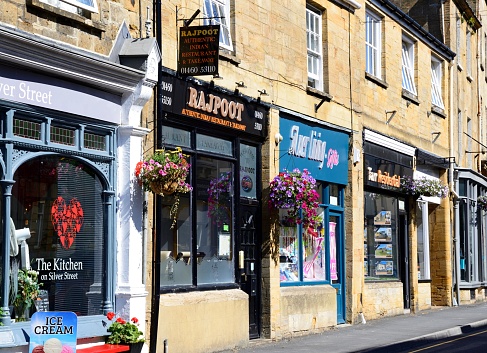 Traditional shops along Silver Street in the town centre, Ilminster, Somerset, UK, Europe.