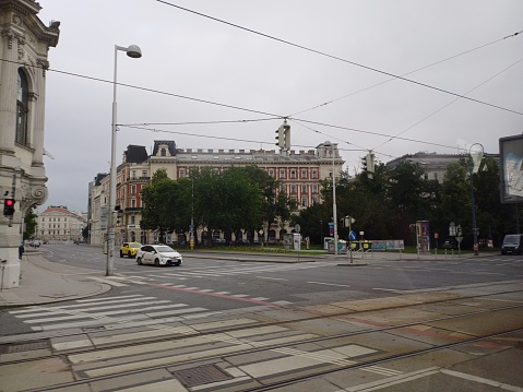 Vienna, Austria - June 7, 2023: Street view in Vienna city with sidewalk, buildings, transportation.