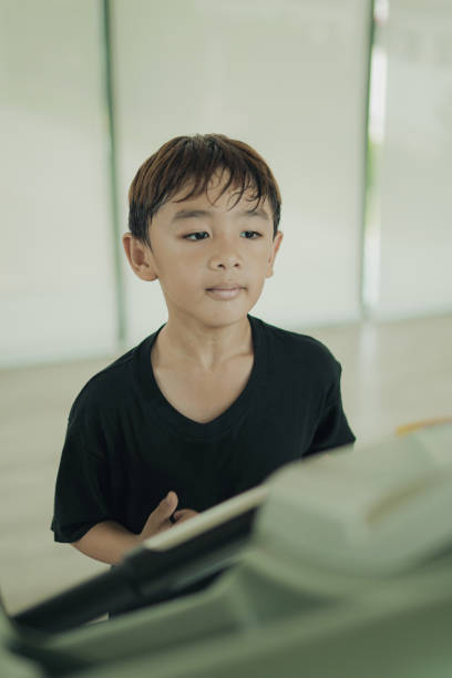 Close-up Boy running on a treadmill in the fitness room
