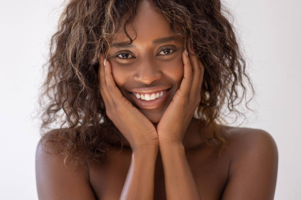 istock Beautiful young woman touching her face 2022301546