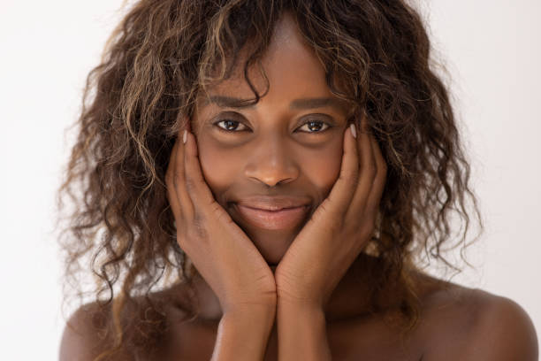 istock Beautiful young woman touching her face 2022302585