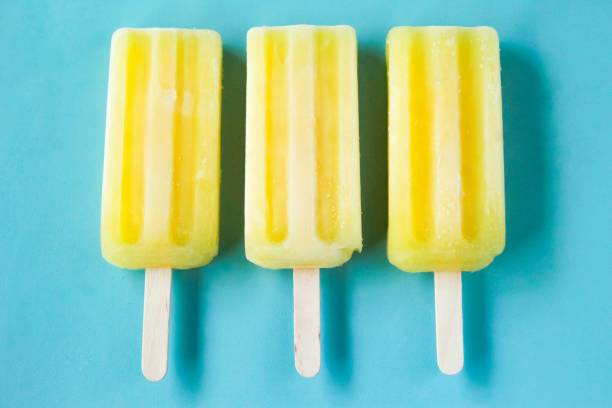 istock some yellow ice cream, on a blue background 2022320189