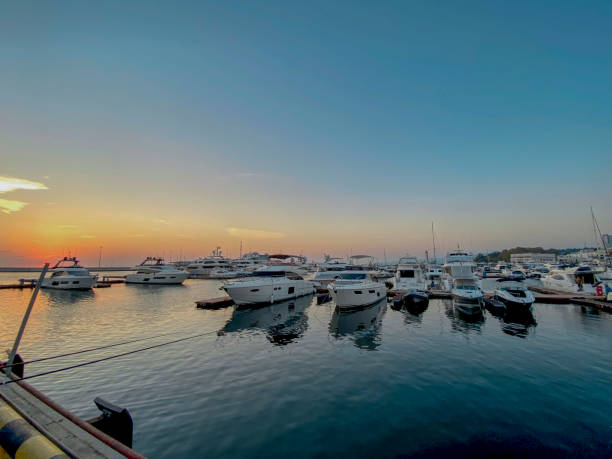 istock Yachts and boats in the harbor at sunset 2022321885