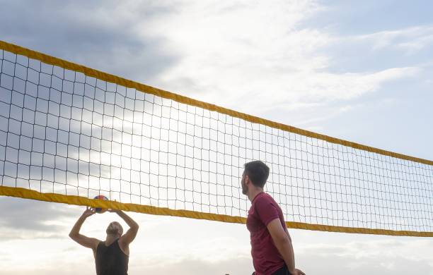 istock Two friends playing beach volleyball 2022331984