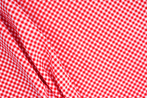 Red firebrick gingham pattern texture as background.