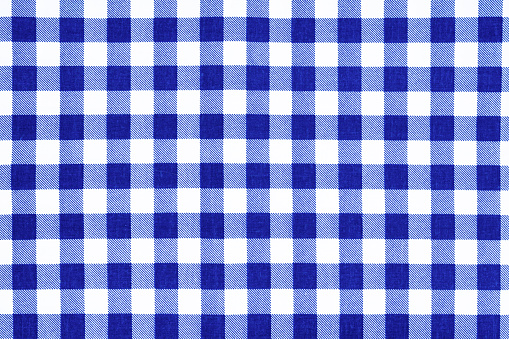 Image of a Blue checkered gingham cloth texture as background.