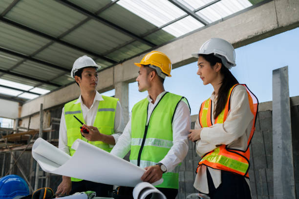 istock team engineer, foreman, architect meeting for colleagues discussing and checks construction blueprints at onsite 2022342741