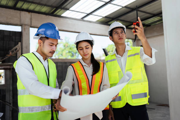 istock team engineer, foreman, architect meeting for colleagues discussing and checks construction blueprints at onsite 2022346977