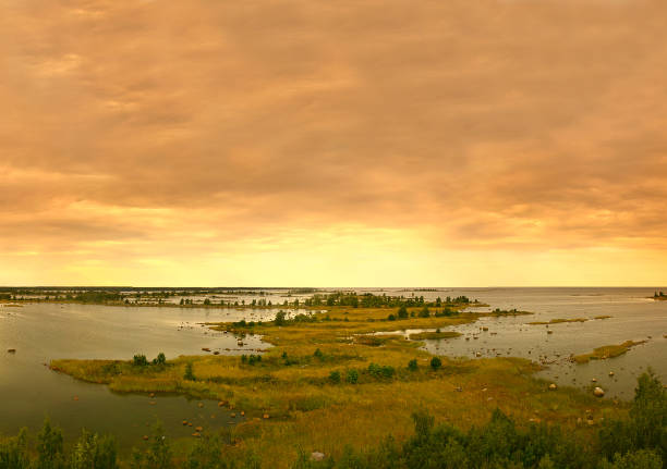 Sunset of Kvarken Archipelago, situated in the Gulf of Bothnia, a northern extension of the Baltic Sea. Finland - UNESCO World Heritage Site - low flat islands between Finland and Sweden