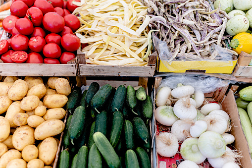 A visual feast unfolds as the camera pans across a picturesque scene at the street market, revealing an enticing display of assorted vegetables in all their natural glory