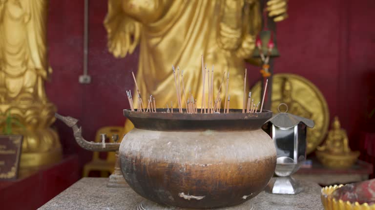 Old historical metal Censer at Buddhist temple, praying in temple, people lights incense and praying