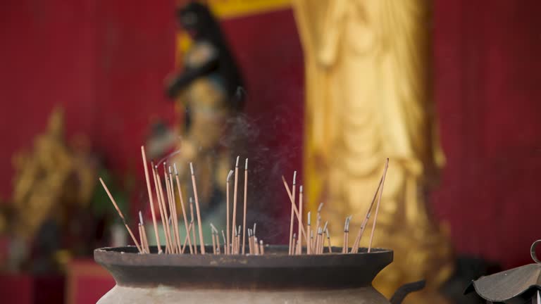 Old historical metal Censer at Buddhist temple, praying in temple, people lights incense and praying