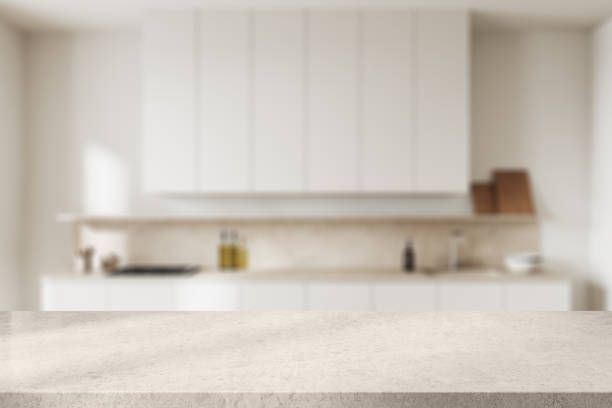 istock Stone countertop on background of kitchen interior with cooking space. Mockup 2022395676