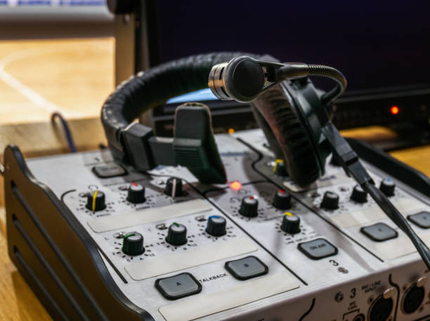 istock Mixing console and headset at the workplace of a sports commentator 2022416371