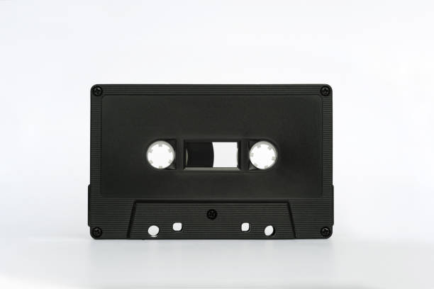 istock Black audio cassette standing isolated on white background 2022416491