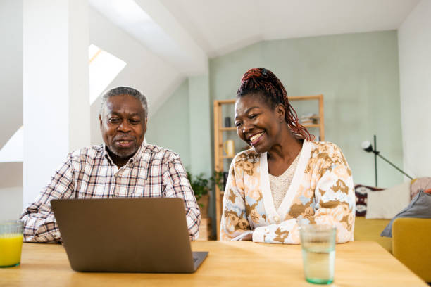 istock Happy senior couple working with clients online 2022426542