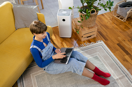 Young woman working from home online.