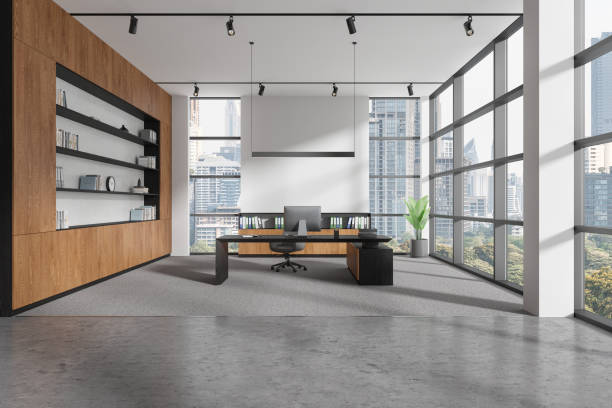 istock Modern office interior with work desk near window, pc desktop and sideboard 2022427067