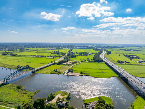 istock Highway over a bridge crossing a river seen from above 2022429200