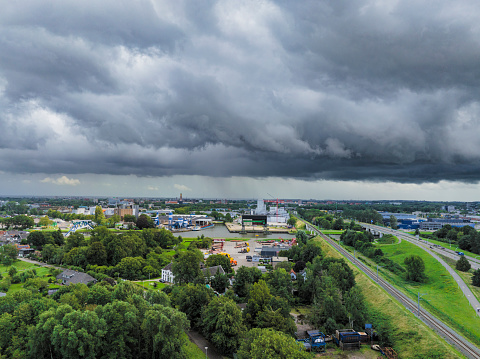 Industrial district Voorst in Zwolle seen from above with an incoming thunderstrom in the sky.