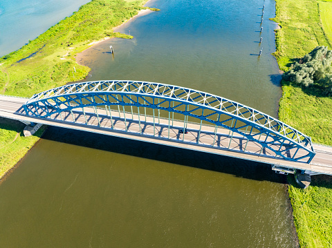 Oude IJsselbrug or Katerveerbrug bridge over the river IJssel near the city of Zwolle in Overijssel, The Netherlands. Aerial drone point of view.