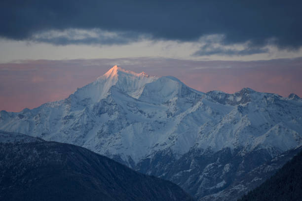 The snow-covered mountains under a cloudy sky. Bettmeralp, Switzerland