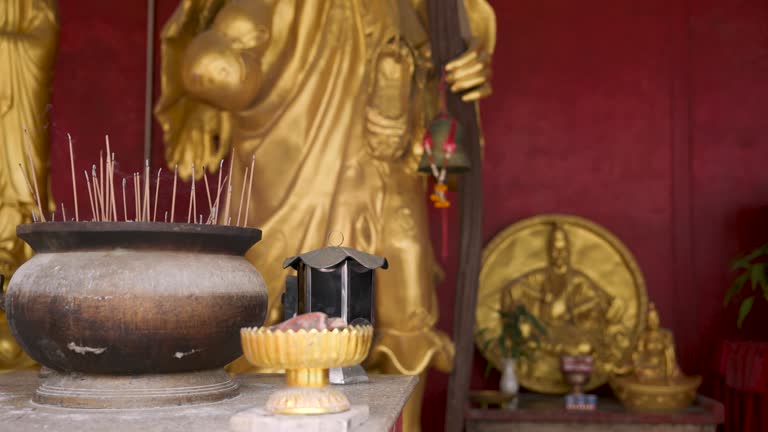 Old historical metal Censer at Buddhist temple, praying in temple, people lights incense and praying