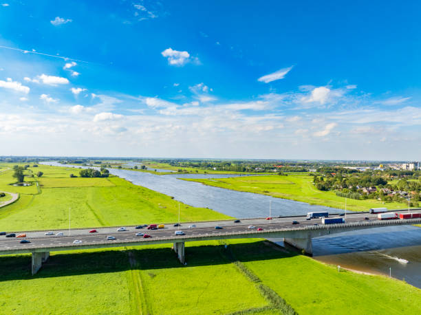 istock Highway over a bridge crossing a river seen from above 2022438813