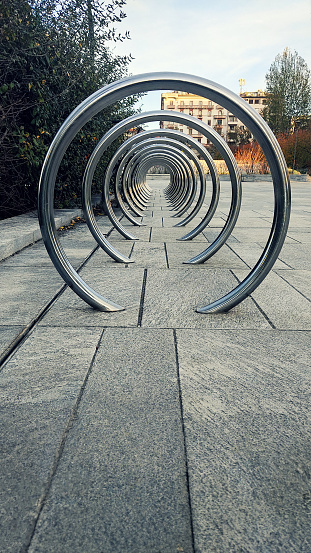 Bicycle parking concentric metal rings in Milan