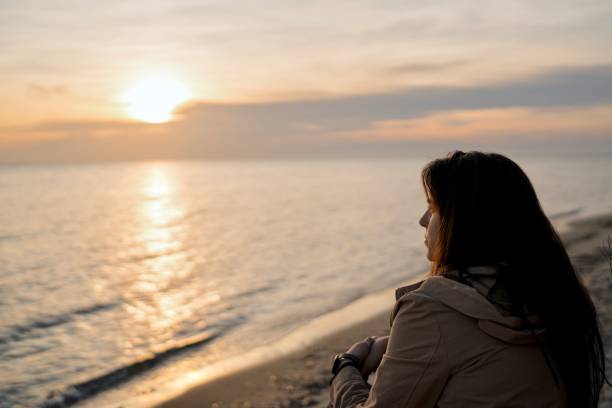 istock Woman being hopeful at the beach 2022444448