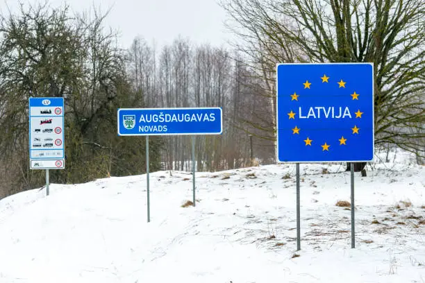Latvian border road sign, Baltic countries, European Union, in winter with snow