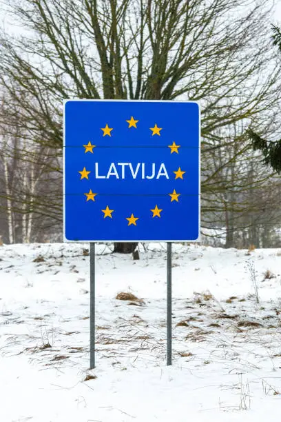 Latvian border road sign, Baltic countries, European Union, in winter with snow