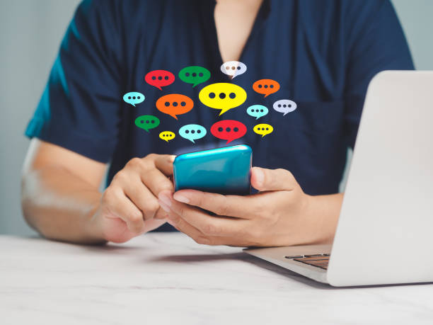 istock Man using a smartphone with social media icons. 2022467727