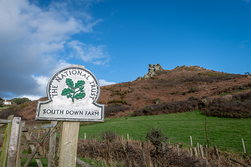 White gate entrance to a private road on a country lane