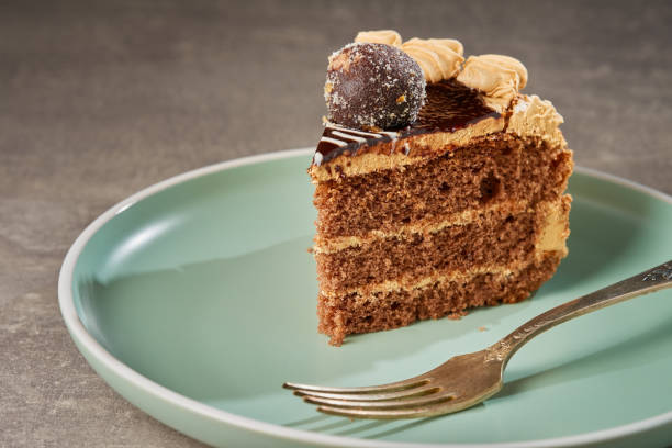 istock Slices of chocolate cake decorated with cream in plate. 2022484893