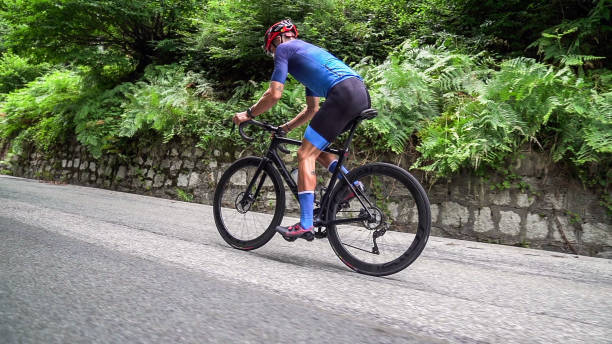 istock Bicycle racing cyclist on asphalt road 2022485942
