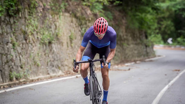 istock Bicycle racing cyclist on asphalt road 2022489192